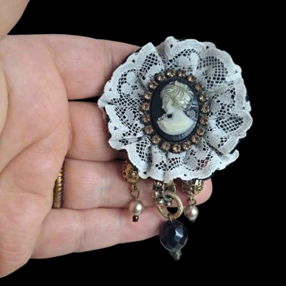 Vintage-Inspired White Lace Cameo Brooch with Black and Gold Accents